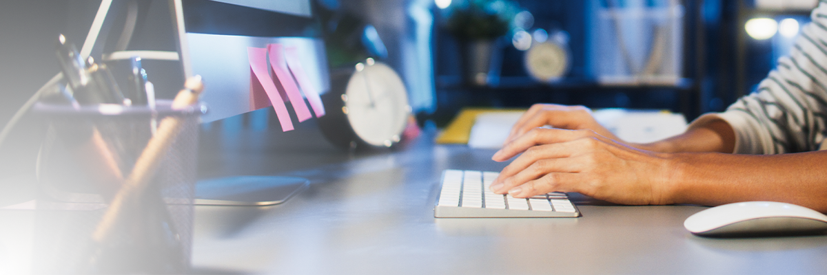 hands typing on keyboard